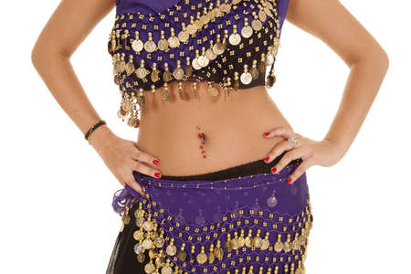 a belly dancer with her hands on her hips.の写真素材