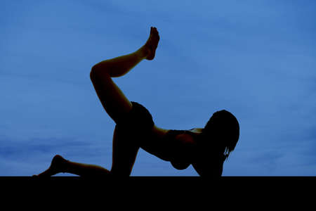 A woman silhouette body shape on a blue background.の写真素材