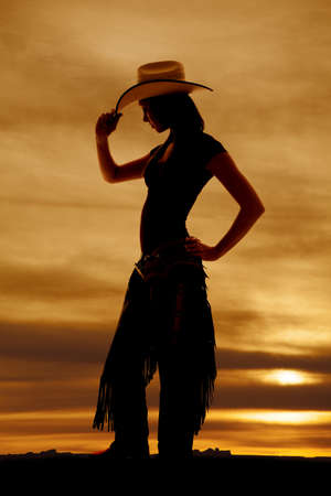 A silhouette of a woman in her western wear.の写真素材