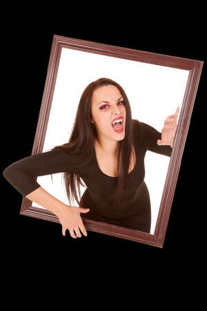 a female vampire coming out of a picture frame.の写真素材