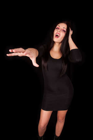 A woman vampire reaching out her hand at the camera.の写真素材