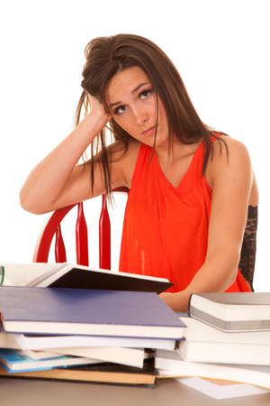 A woman wearing a red top is frustrated.の写真素材