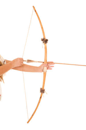 A woman holding a bow and an arrow ready to shoot.の写真素材