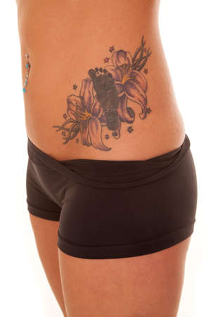 A woman has a tattoo of a footprint on her hip.の写真素材