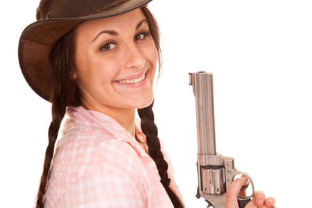 A woman with a smile on her face holding on to her pistolの写真素材