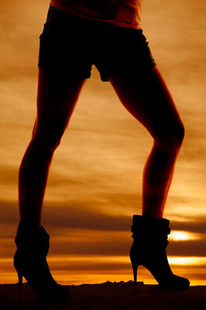 A silhouette of a woman's legs posing.の写真素材