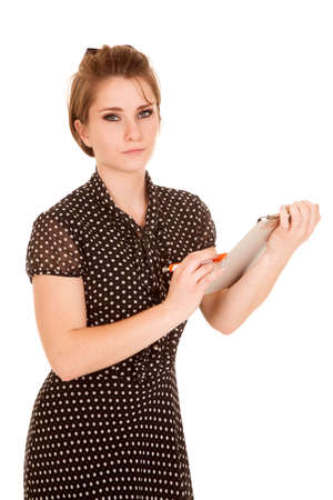 A woman working on her clipboard with a pen upset.の写真素材