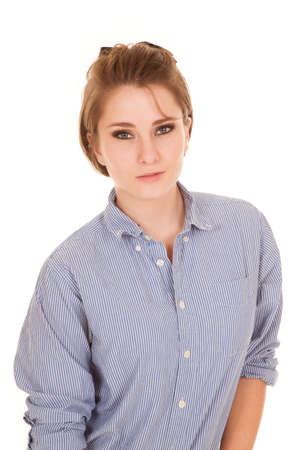 a woman in her casual top with a small smile on her lips.の写真素材