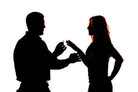 a silhouette of a man giving a wedding ring to a woman.の写真素材