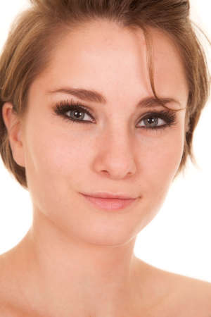 a close up of a woman with a small smile on her face.の写真素材