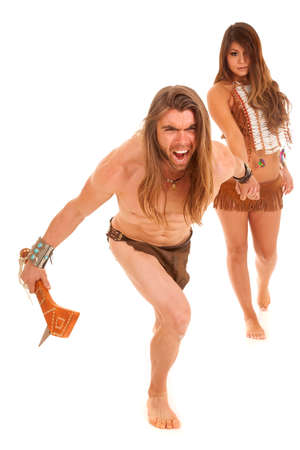 An intense man with a club holding hands with his indian princess.の写真素材