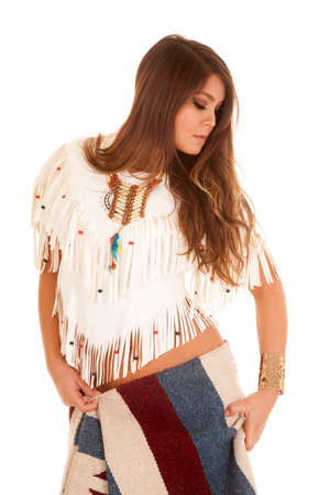 a Native American woman looking down to the side with her blanket wrapped around her hips.の写真素材