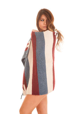 a Native American looking over her shoulder wrapped up in a blanket.の写真素材