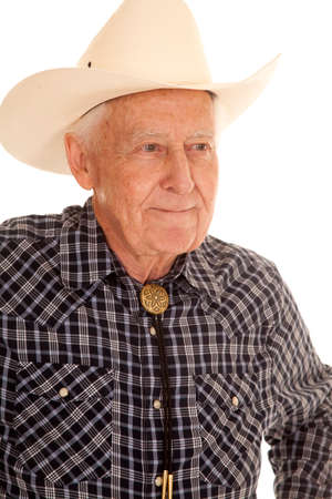 An elderly man in a cowboy hat up close serious.の写真素材