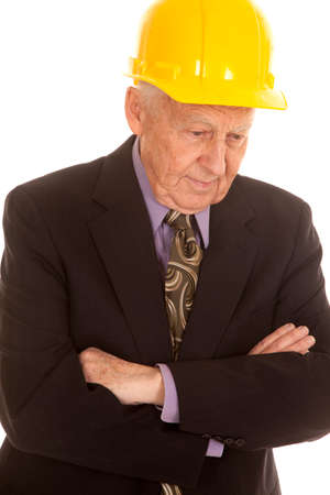 An elderly man in a suit and a hard hat.の写真素材