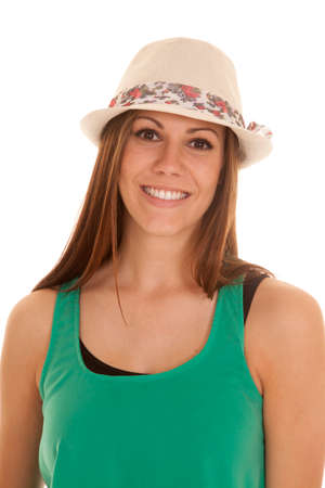 a woman wearing a cute hat with a smile on her face.の写真素材