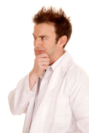 A doctor in a white labe coat side thinking.の写真素材