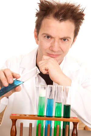 A mad scientist is ready to pour chemicals together using test tubes.の写真素材