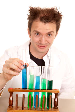 A mad scientist is ready to pick up a test tube.の写真素材