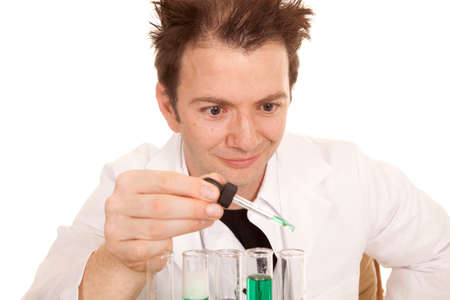 A crazy scientist is dropping liquid into a test tube.の写真素材