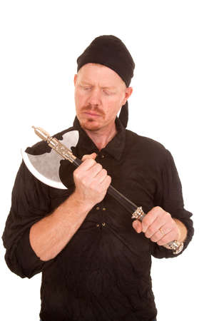 A man is holding an axe in his hands.の写真素材