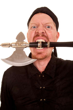 A crazy man with an axe in his mouth.の写真素材