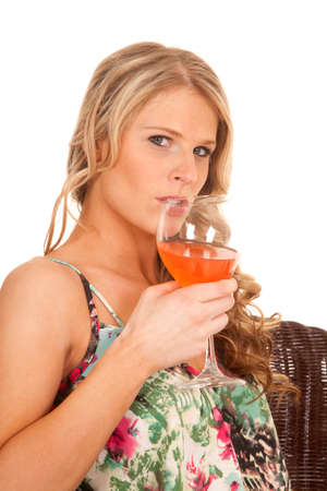 a woman getting ready to take a drink of her drink.の写真素材