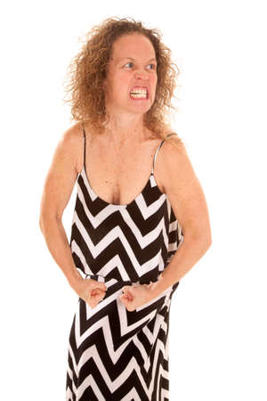 a woman flexing her muscles with a mean face.の写真素材