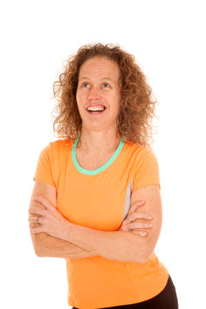 A woman in her fitness clothes with her arms folded and a funny expression on her face.の写真素材