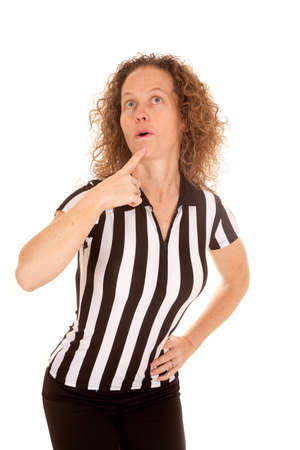 a woman referee pausing to think before making a call.の写真素材