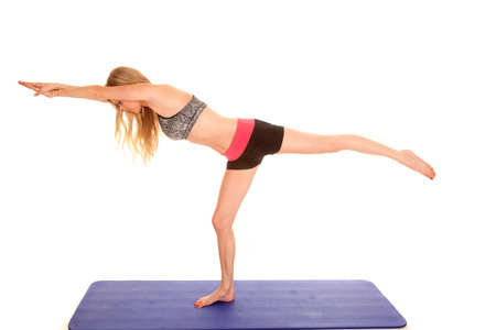 a woman in her fitness clothing stretching.の写真素材