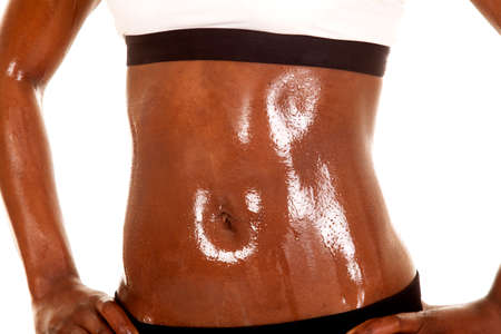 An African American up close. Showing her belly after a workout.の写真素材