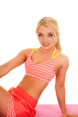 a woman in her fitness clothing posing her body.の写真素材