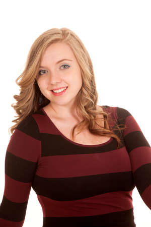 a woman in her black and red striped dress smiliingの写真素材