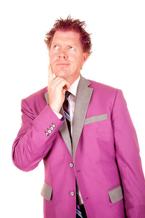 A man in a purple suit with a funny expression and purple hair.の写真素材