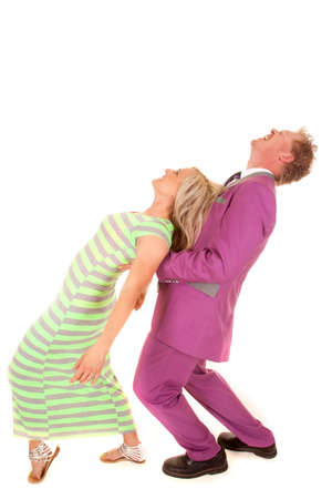 A woman and man both leaning back, the woman is leaning back on the man.の写真素材