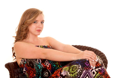 a woman in her colorful dress with a serious expression on her faceの写真素材