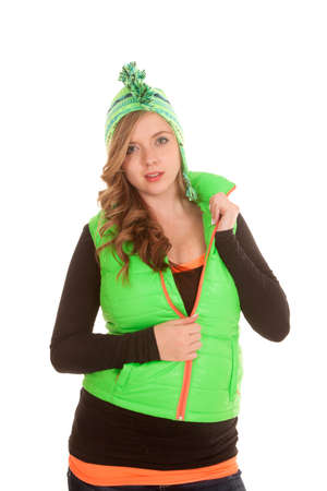 a woman in her winter clothing zipping up her vest.の写真素材