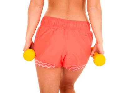 a close up of a woman working out with weights.の写真素材