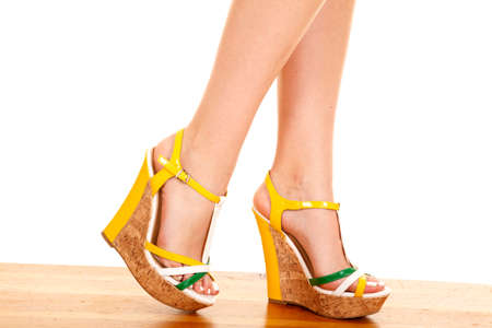 A close up of a woman walking in her shoes.の写真素材