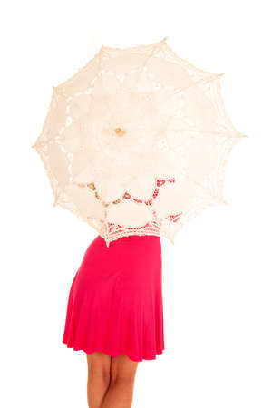 a woman's back holding on to an umbrella.の写真素材