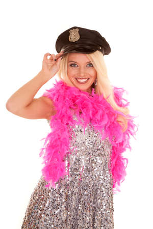 a woman in her silver dress and pink boa wearing a police hat.の写真素材