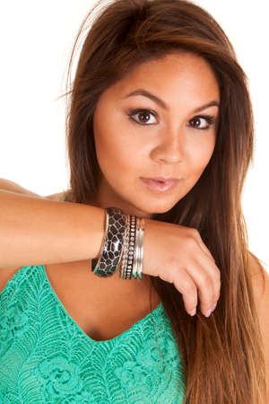 a woman holding up her arm, showing off her bracelets.の写真素材