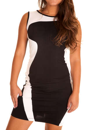 A woman in her short black and white fitted dressの写真素材