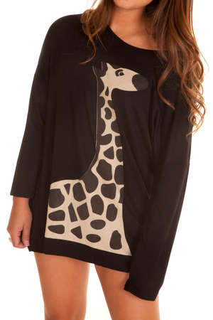 A close up of a woman in her giraffe sweater dress.の写真素材