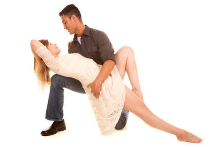 A man and woman doing a dance pose. Looking into each others eyes.の写真素材