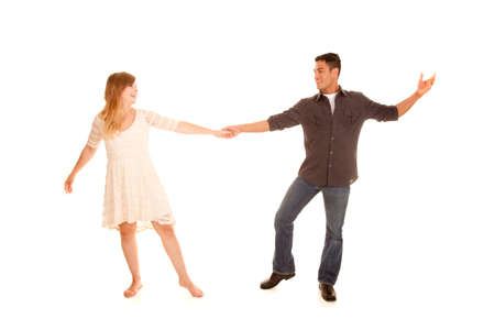 A man and woman with smiles on their faces dancing.の写真素材