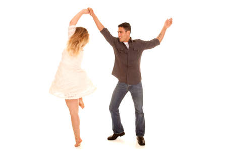 A couple having some fun dancing and spinning.の写真素材