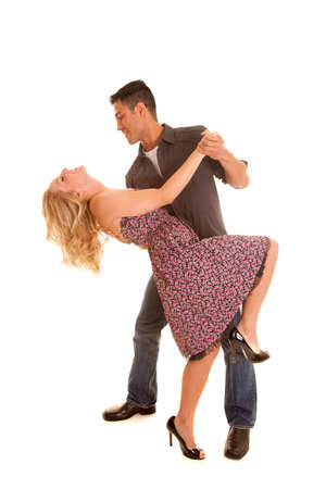 A man and woman dancing he is looking down at her.の写真素材