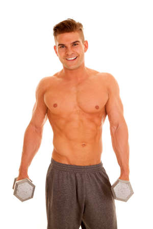 a man with a smile on his face holding onto weights.の写真素材